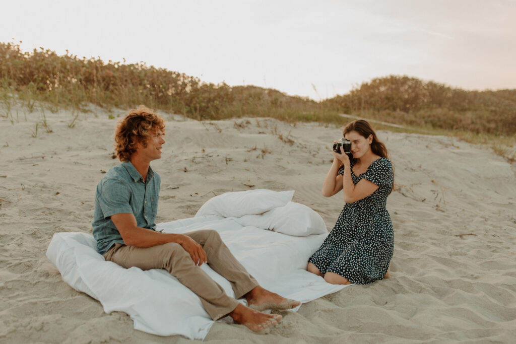 film camera beach engagement session with air mattress